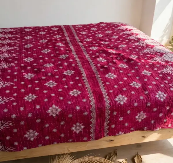 Hand stitched kantha 30 layer magenta floral design king size lifestyle on bed
